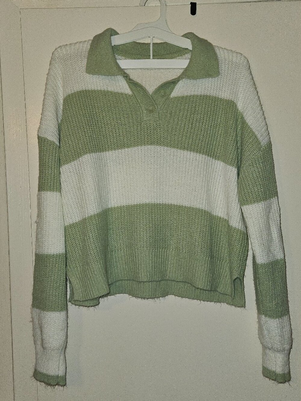Green and white striped sweater